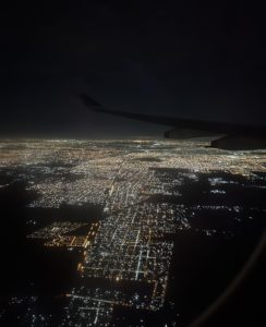 the lit up city of Buenos Aires from the airplane window